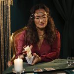 fortune-teller-with-tarot-cards-medium-shot