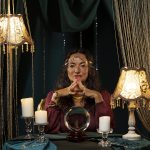 front-view-fortune-teller-with-globe