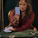 front-view-fortune-teller-with-tarot-cards