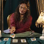 medium-shot-fortune-teller-with-tarot-cards-1